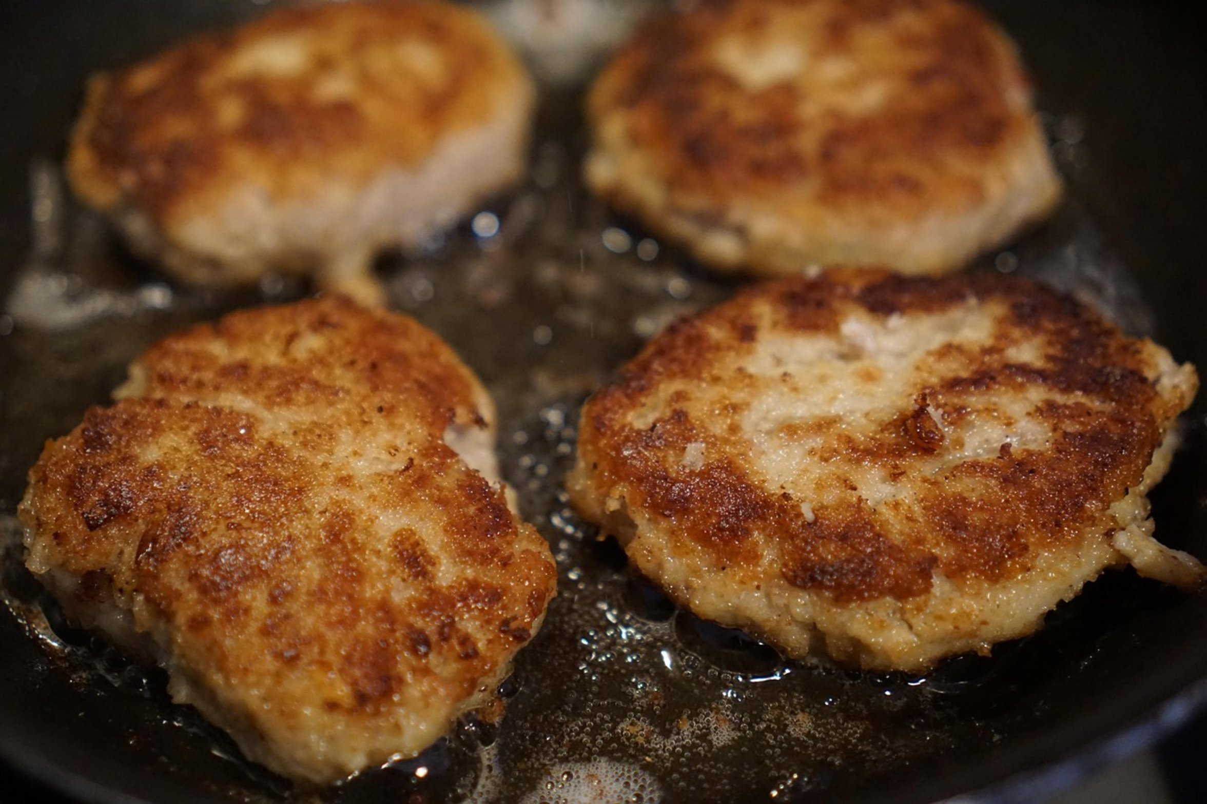 frying fish in skillet frying fish in skillet