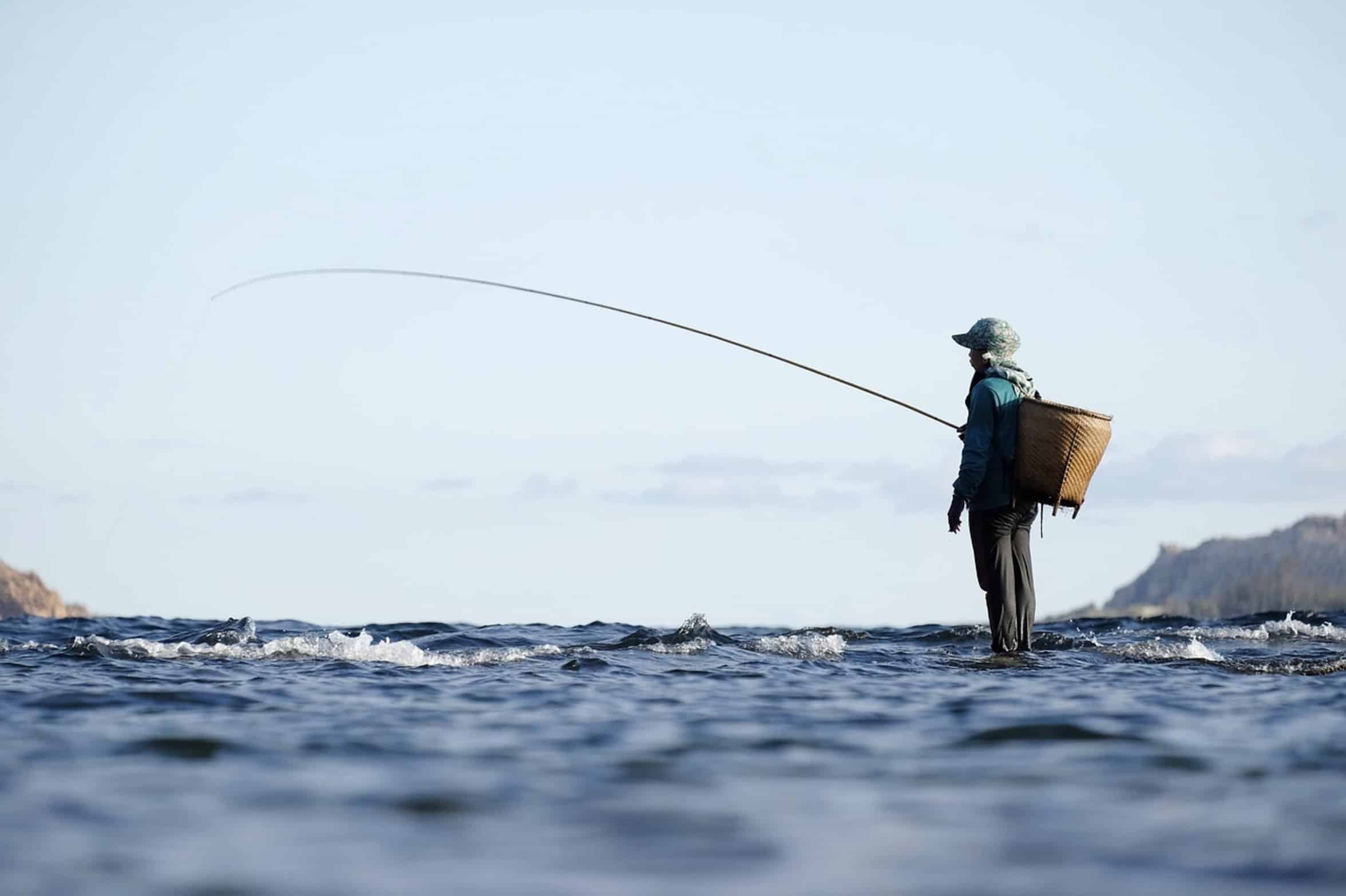 man testing fishing rod man testing fishing rod