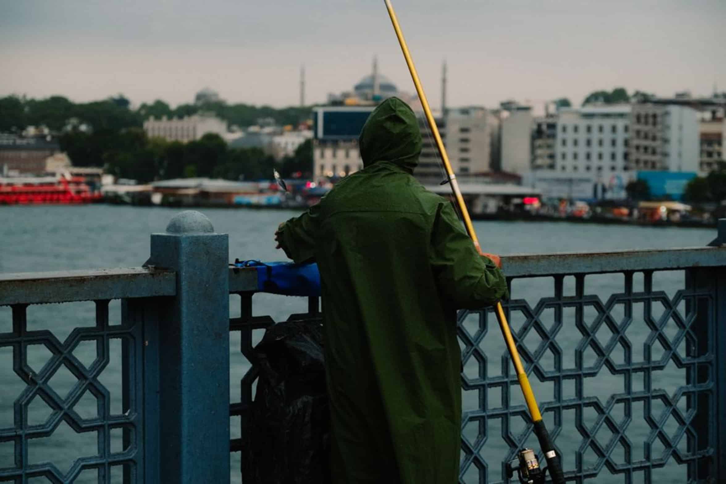 person holding long pole person holding long pole
